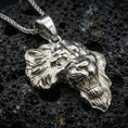 Load image into Gallery viewer, Polished silver lion head pendant necklace displayed on black volcanic rock, shown in a refined macro product shot with detailed mane and facial sculpting.