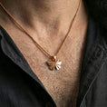 Load image into Gallery viewer, Rose gold plated origami butterfly pendant necklace worn on the neck, presented in a close-up lifestyle shot with a refined masculine aesthetic.