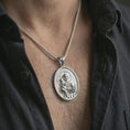 Load image into Gallery viewer, Polished silver Saint Anthony pendant necklace worn on the neck, shown against the chest in a clean and elegant everyday wear composition.