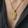Load image into Gallery viewer, Gold plated Saint Martin of Tours pendant necklace worn on the neck, captured on a human model in a premium dark-toned lifestyle frame.