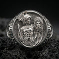 Load image into Gallery viewer, A polished 925 sterling silver Greek mythology signet ring on volcanic rock, detailed Perseus figure with Medusa head.