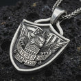 Load image into Gallery viewer, Sterling silver Fortiores Una eagle shield pendant necklace with an oxidized finish resting on textured volcanic rock, captured in a close-up premium studio composition.