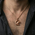 Load image into Gallery viewer, Rose gold plated Viking raven pendant necklace worn on the neck, presented in an elegant close-up styling shot with a bold masculine aesthetic.
