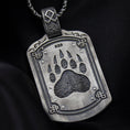Load image into Gallery viewer, Bear paw pendant in oxidized finish over sterling silver