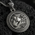 Load image into Gallery viewer, Sterling silver horse head pendant necklace with an oxidized finish resting on textured volcanic rock, captured in a close-up premium studio composition.