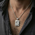 Load image into Gallery viewer, Polished silver cobra pendant necklace worn on the neck, shown against the chest in a clean and elegant everyday wear composition.