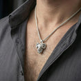 Load image into Gallery viewer, Polished silver ram head pendant necklace worn on the neck, shown against the chest in a clean and elegant everyday wear composition.