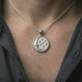 Load image into Gallery viewer, Polished silver moon and stars pendant necklace worn on the neck, shown against the chest in a clean and elegant everyday wear composition.