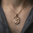 Load image into Gallery viewer, Rose gold plated Roman soldier pendant necklace worn on the neck, presented in a close-up lifestyle shot with a refined masculine aesthetic.