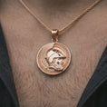 Load image into Gallery viewer, Rose gold plated Spartan helmet pendant necklace worn on the neck, presented in a close-up lifestyle shot with a refined warrior aesthetic.