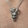 Load image into Gallery viewer, Polished silver rabbit skull pendant necklace worn on the neck, shown against the chest in a clean and dramatic everyday wear composition.