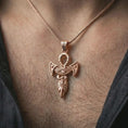 Load image into Gallery viewer, Rose gold plated Eye of Horus ankh pendant necklace worn on the neck, presented in a close-up lifestyle shot with a refined mystical aesthetic.