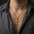Load image into Gallery viewer, Gold plated Orthodox cross pendant necklace worn on the neck, captured on a human model in a premium dark-toned lifestyle frame.