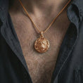 Load image into Gallery viewer, A rose gold plated tiger pendant worn on the neck, warm metallic tone enhancing the leaf wreath and tiger features.