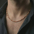 Load image into Gallery viewer, Rose gold plated DNA helix chain necklace worn on the neck, presented in a close-up lifestyle shot with a refined science-inspired aesthetic.