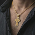 Load image into Gallery viewer, Gold plated Orthodox cross pendant necklace worn on the neck, captured on a human model in a premium dark-toned lifestyle frame.