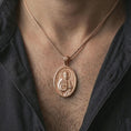 Load image into Gallery viewer, Rose gold plated Saint Peter pendant necklace worn on the neck, presented in a close-up lifestyle shot with a refined masculine aesthetic.