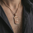 Load image into Gallery viewer, Rose gold plated Saint George dog tag pendant necklace worn on the neck, presented in a close-up lifestyle shot with a refined masculine aesthetic.
