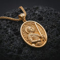 Load image into Gallery viewer, Gold plated Saint Martin of Tours pendant necklace presented on porous volcanic rock, highlighting the oval medallion form and sacred devotional design in a luxurious close-up jewelry image.