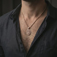 Load image into Gallery viewer, Rose gold plated Saint Martin of Tours pendant necklace worn on the neck, presented in a close-up lifestyle shot with a refined masculine aesthetic.