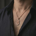 Load image into Gallery viewer, Rose gold plated Jesus INRI crucifixion pendant necklace worn on the neck, presented in a close-up lifestyle shot with a refined masculine aesthetic.