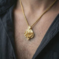Load image into Gallery viewer, Gold plated chessboard pendant necklace worn on the neck, captured on a human model in a premium dark-toned lifestyle frame.