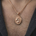 Load image into Gallery viewer, Rose gold plated wolf medallion pendant necklace worn on the neck, presented in a close-up lifestyle shot with a refined wildlife-inspired aesthetic.