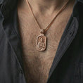 Load image into Gallery viewer, Rose gold plated Saint Peter dog tag pendant necklace worn on the neck, presented in a close-up lifestyle shot with a refined masculine aesthetic.
