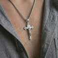 Load image into Gallery viewer, Polished silver crucifix pendant necklace worn on the neck, presented in a clean model shot with a timeless faith-centered and sacred appearance.