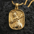 Load image into Gallery viewer, Gold plated Spartan warrior pendant necklace presented on porous volcanic rock, highlighting the rectangular warrior motif in a luxurious close-up jewelry image.