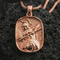 Load image into Gallery viewer, Rose gold plated Spartan warrior pendant necklace on dark volcanic rock, photographed in a detailed premium studio macro view.