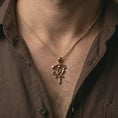 Load image into Gallery viewer, Rose gold plated Eye of Ra and Ankh pendant necklace worn on the neck, presented in a close-up lifestyle shot with a refined masculine aesthetic.