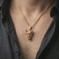 Load image into Gallery viewer, Rose gold plated Oni mask pendant necklace worn on the neck, presented in a close-up lifestyle shot with a refined masculine aesthetic.
