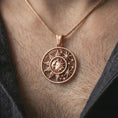 Load image into Gallery viewer, Rose gold plated sun and moon pendant necklace worn on the neck, presented in a close-up lifestyle shot with a refined masculine aesthetic.