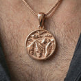 Load image into Gallery viewer, Rose gold plated mountain landscape pendant necklace worn on the neck, presented in a close-up lifestyle shot with a refined masculine aesthetic.