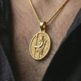 Load image into Gallery viewer, Gold plated Achaemenid soldier pendant necklace worn on the neck, captured in a premium lifestyle composition with the oval Persian warrior pendant centered on the chest.