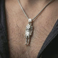 Load image into Gallery viewer, Polished silver Ra amulet pendant necklace worn on the neck, shown in a clean model shot with the ancient Egyptian figure centered for a refined mythology-inspired look.