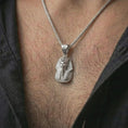 Load image into Gallery viewer, Polished silver Tutankhamun pharaoh pendant necklace worn on the neck, shown in a clean model shot with the ancient Egyptian bust centered for a refined mythology-inspired look.