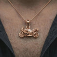 Load image into Gallery viewer, Rose gold plated sportbike motorcycle pendant necklace worn on the neck, presented in a close-up lifestyle shot with a refined masculine aesthetic.