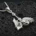 Load image into Gallery viewer, Polished silver paladin hammer pendant necklace displayed on black volcanic rock, shown in a refined macro product shot with medieval weapon detail, spiked head, and knightly ornamentation.