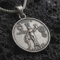 Load image into Gallery viewer, Sterling silver Venus Amor pendant necklace with an oxidized finish resting on textured volcanic rock, captured in a close-up premium studio composition.