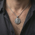 Load image into Gallery viewer, A polished sterling silver Oni pendant worn on the neck, styled as a modern unisex statement piece.