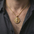 Load image into Gallery viewer, A gold plated Oni mask pendant worn on the neck, layered streetwear look with sharp relief and defined edges.