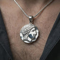 Load image into Gallery viewer, Polished silver ancient Greek coin pendant necklace worn on the neck, shown in a clean model shot with the antique-inspired medallion centered for a refined antiquity look.