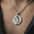 Load image into Gallery viewer, Polished silver Nefertiti medallion pendant necklace worn on the neck, shown against the chest in a clean and graceful everyday wear composition.
