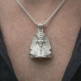 Load image into Gallery viewer, Polished silver Tutankhamun pendant necklace worn on the neck, shown against the chest in a clean and elegant everyday wear composition.