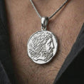 Load image into Gallery viewer, Polished silver ancient Greek coin pendant necklace worn on the neck, shown in a clean model shot with the antique-inspired medallion centered for a refined antiquity look.