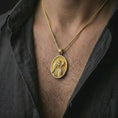 Load image into Gallery viewer, Gold plated Good Shepherd Jesus pendant necklace worn on the chest, premium lifestyle jewelry photo with the Jesus and lamb pendant centered on a spiga chain.