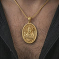 Load image into Gallery viewer, Gold plated Saint Patrick pendant necklace worn on the chest, premium lifestyle jewelry photo with the Irish patron saint medal centered on a spiga chain.