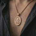 Load image into Gallery viewer, Rose gold plated Saint Anthony of Padua pendant necklace worn on the chest, close-up lifestyle shot featuring the sacred Saint Anthony of Padua design with warm rose gold tones.